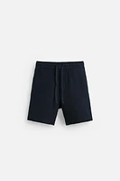 TEXTURED REGULAR FIT BERMUDA SHORTS
