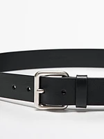 Leather belt with metallic buckle