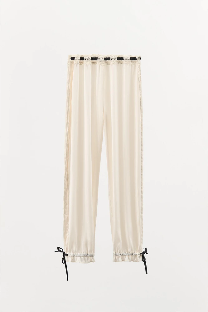 PANTALON SATINÉ AVEC NŒUD EN CONTRASTE