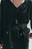 BLOUSE SEMI-TRANSPARENTE