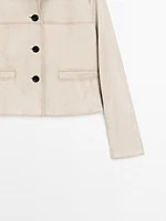 Veste courte à surpiqûres en cuir finition daim