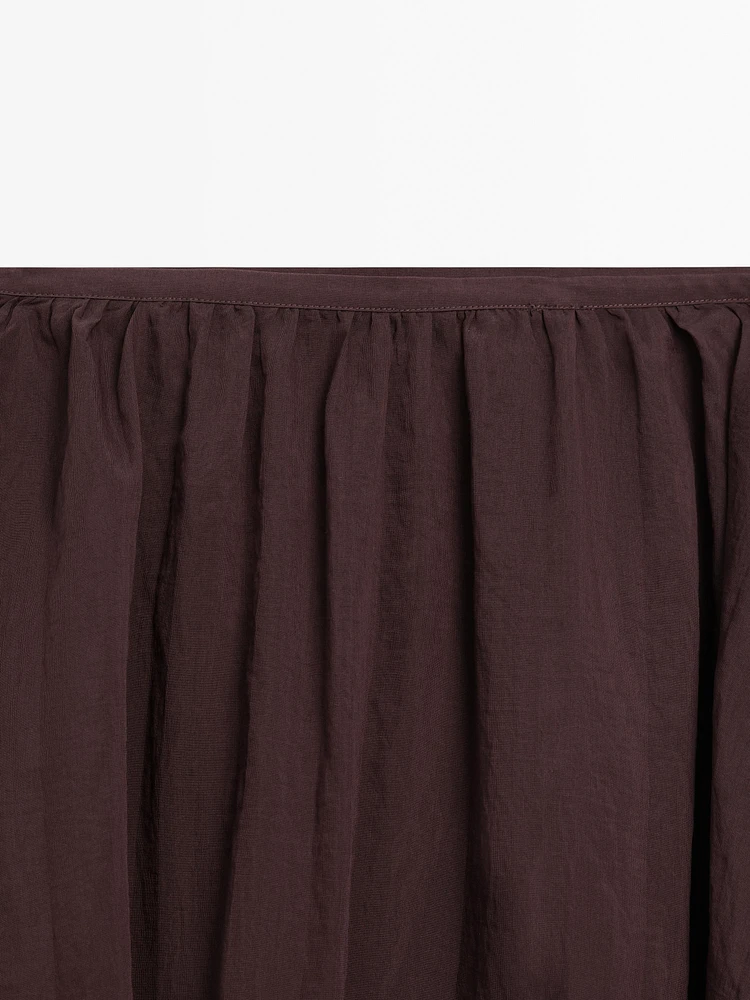 Pleated balloon midi skirt