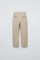 PLEATED TAPERED PANTS