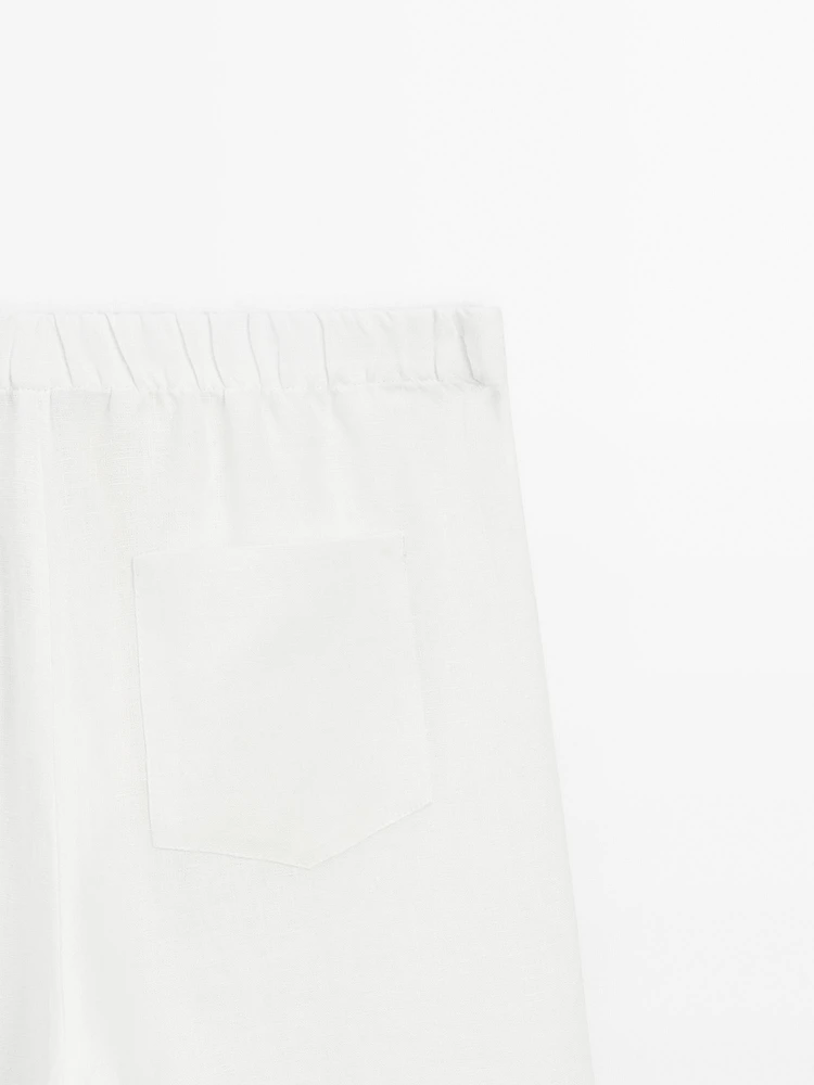 Wide-leg trousers with frayed detailing