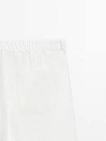Wide-leg trousers with frayed detailing