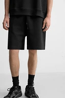 INTERLOCK STRUCTURED SHORTS