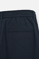 TEXTURED PLEATED PANTS