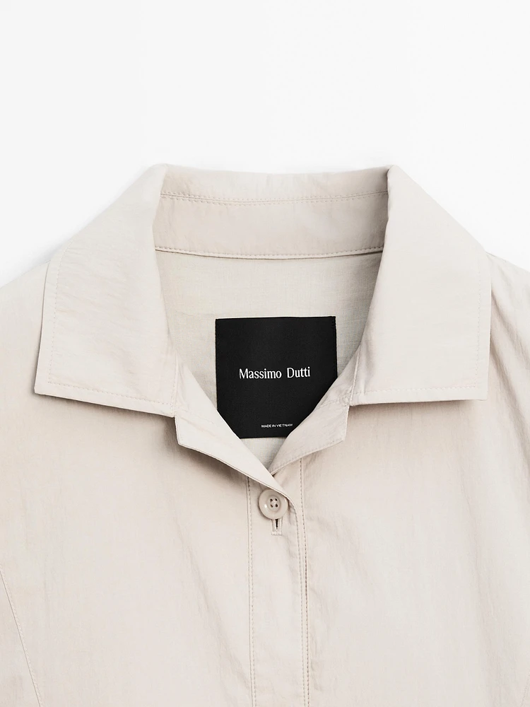 Bomber jacket with seams and gathering