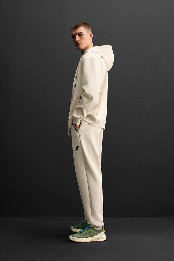 TECHNICAL ZIPPER JOGGER PANTS