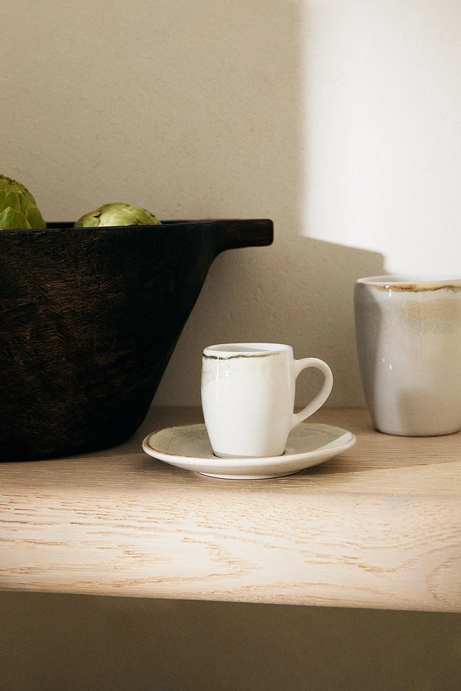 STONEWARE COFFEE CUP AND SAUCER