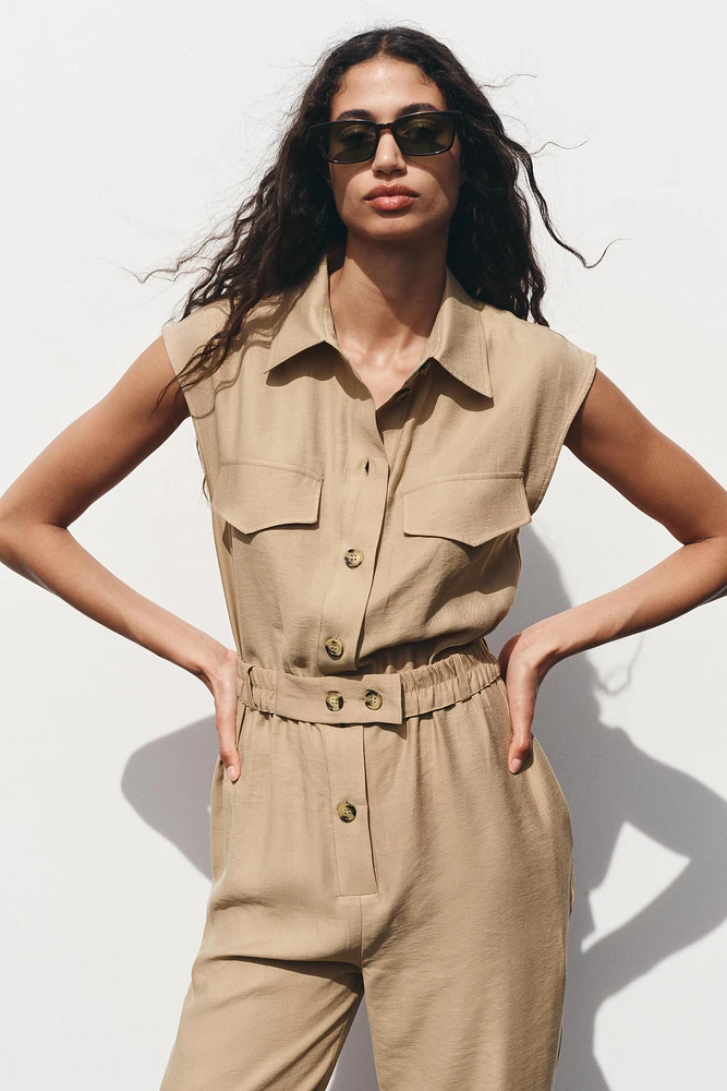 SLEEVELESS BELTED JUMPSUIT