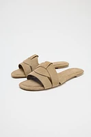 FLAT SUEDE CROSSED SANDALS
