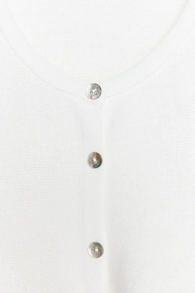 TOP EN MAILLE PÉPLUM
