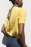 GILET EN MAILLE BOUTON ÉTOILE