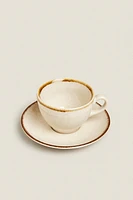 PORCELAIN TEACUP WITH ANTIQUE FINISH RIM