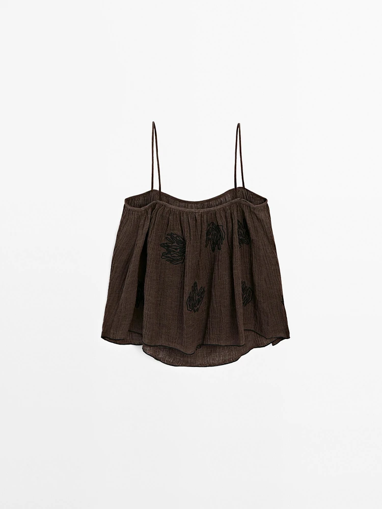 Flowing textured top with embroidered detail