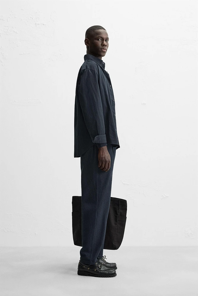 TEXTURED PLEATED PANTS