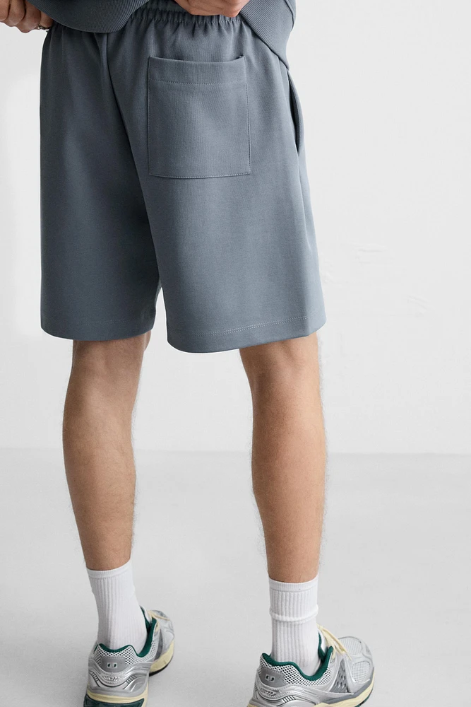 INTERLOCK STRUCTURED SHORTS