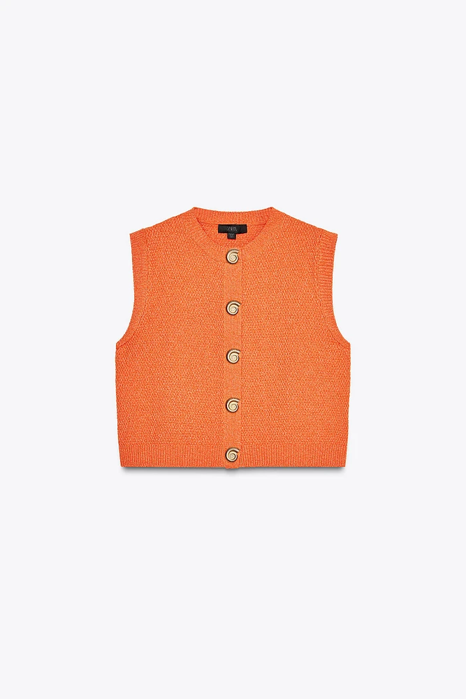 TOP GILET EN MAILLE BOUTON COQUILLAGE