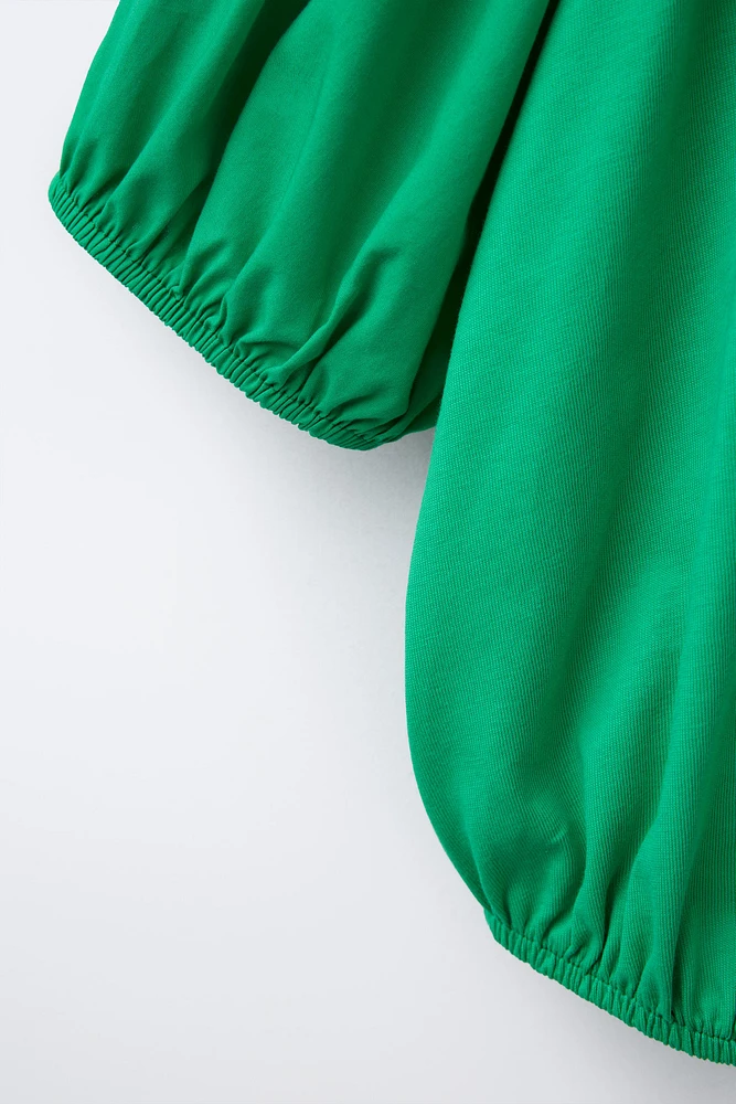 COMBINED ELASTICIZED TOP