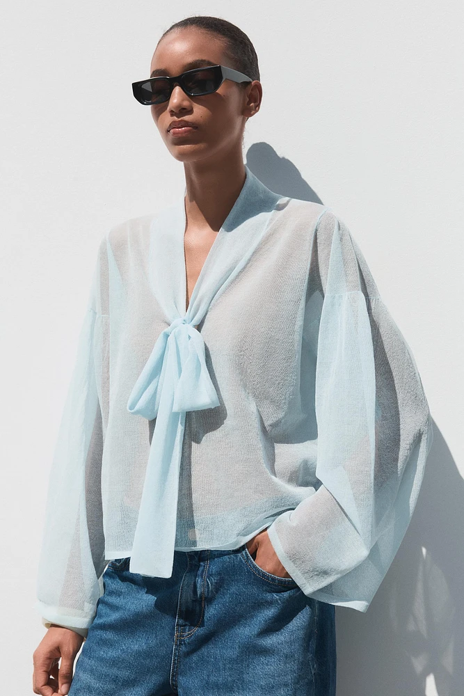 BLOUSE SEMI-TRANSPARENTE EN MAILLE
