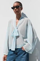 BLOUSE SEMI-TRANSPARENTE EN MAILLE