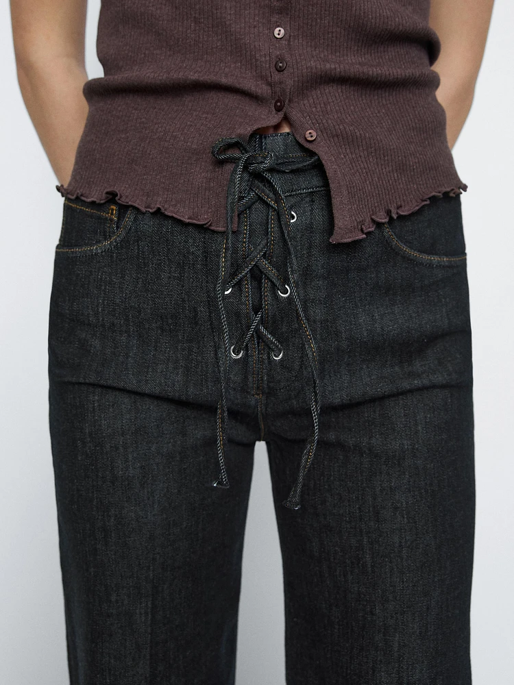 Flared jeans with tie detail