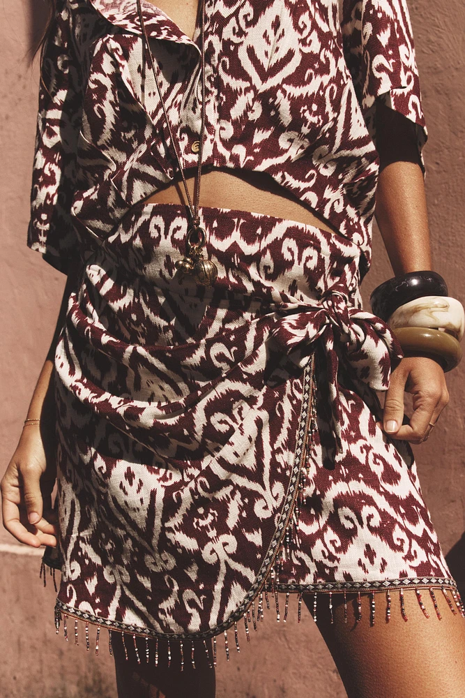 FRINGED BEADED PRINT SKIRT