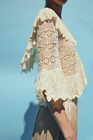 BLOUSE EN MAILLE POINTELLE À VOLANTS