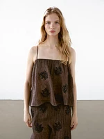 Flowing textured trousers with embroidered detail
