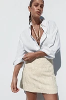 MINI SKIRT WITH FRAYED EMBROIDERY