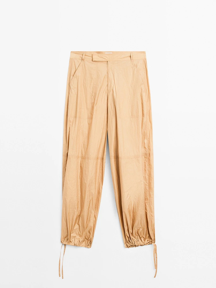 Lightweight trousers with strap details - Studio