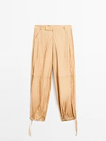 Lightweight trousers with strap details - Studio