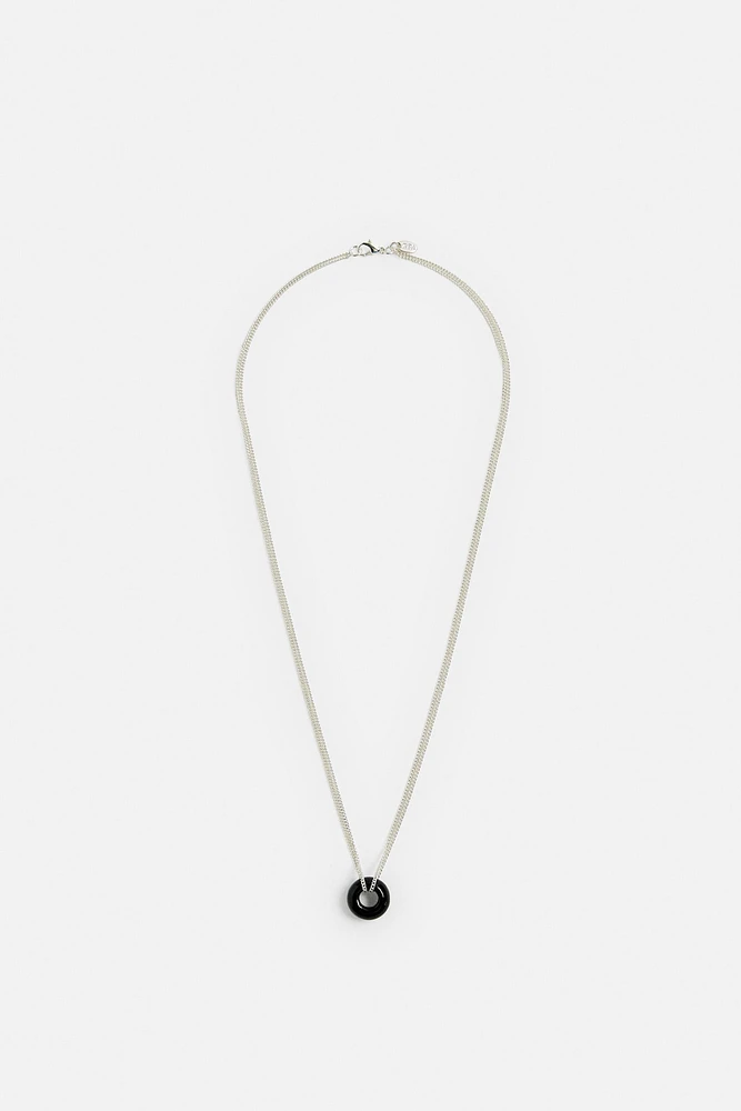 COLLIER PENDENTIF EN MATIÈRES VARIÉES