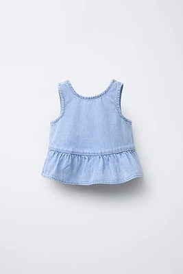 TOP EN DENIM À VOLANTS
