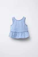 TOP EN DENIM À VOLANTS