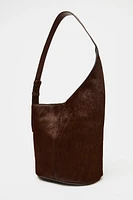 ASYMMETRIC FUR-TRIMMED LEATHER BUCKET BAG