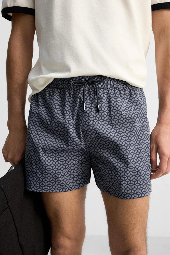 GEOMETRIC PRINT SHORT SWIMMING TRUNKS