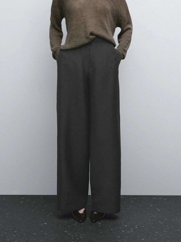 Flowing wide-leg trousers with seam details