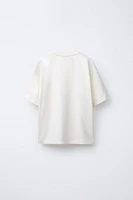 T-SHIRT À POCHE IMPRIMÉE