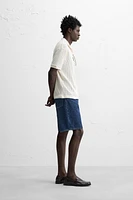 POLO À MAILLES AJOURÉES