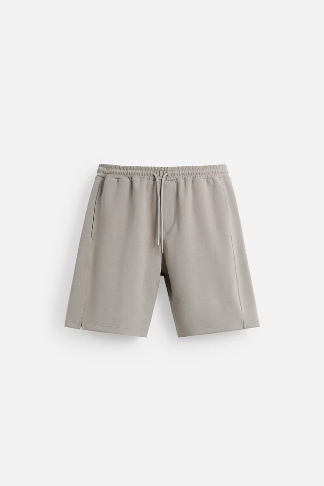 BERMUDA DE JOGGING OVERSIZE TECHNIQUE