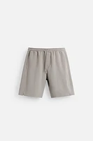 BERMUDA DE JOGGING OVERSIZE TECHNIQUE