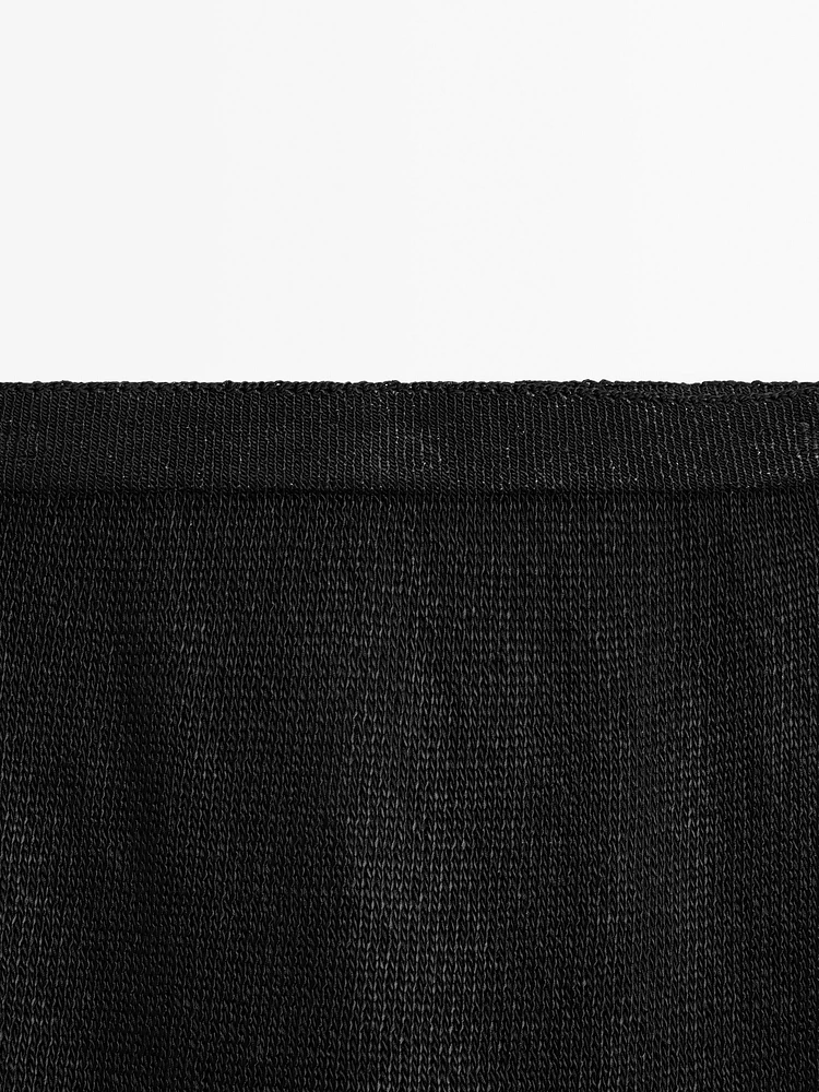 Jupe midi en maille ajourée
