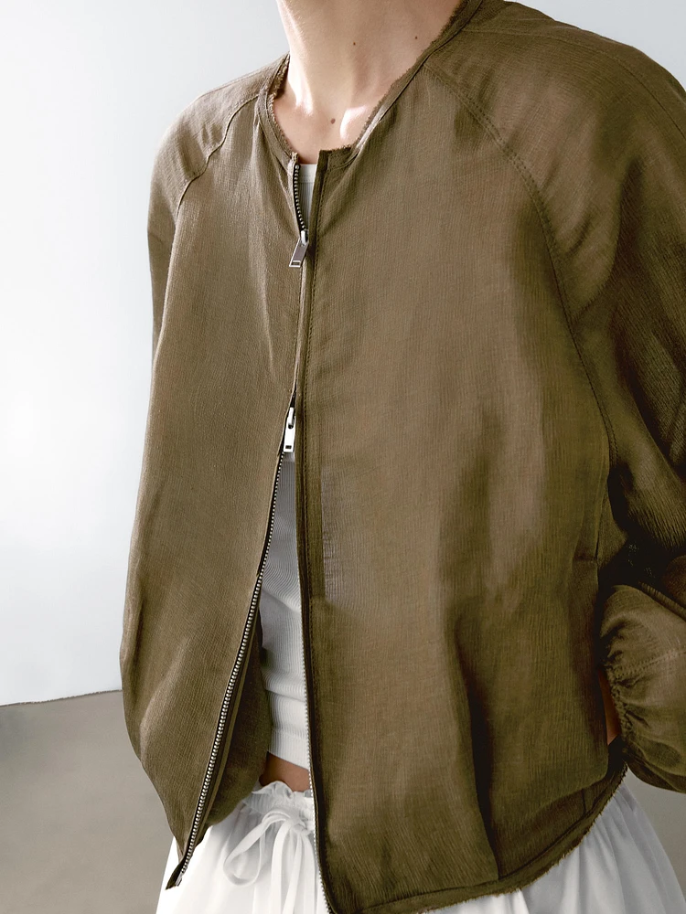 Veste bomber effilochée en lin et soie