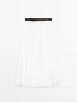 Pleated skirt with leather detail