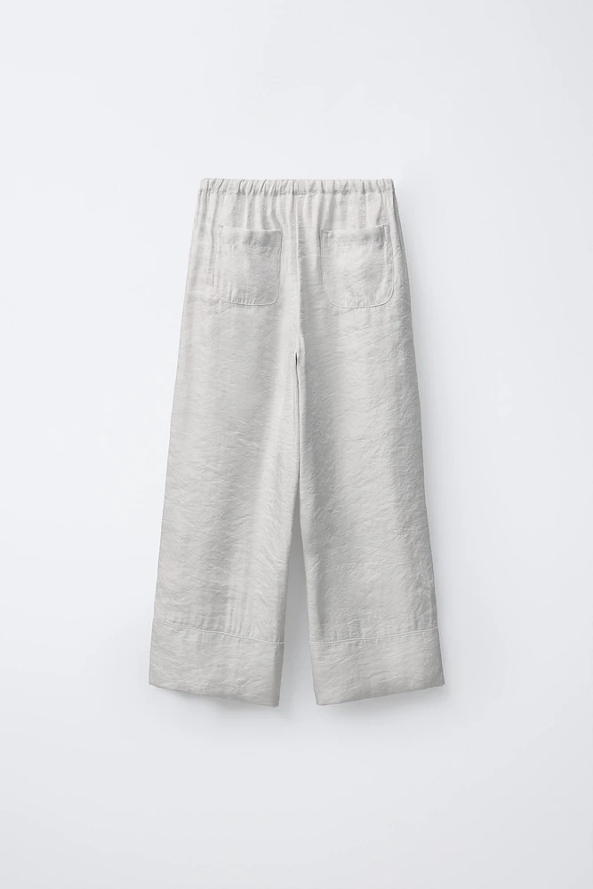 PANTALON JUPE-CULOTTE BRILLANT LACETS