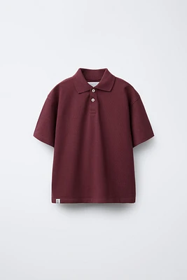 POLO BOXY FIT ÉTIQUETTE