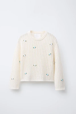PULL RÉSILLE AVEC FLEURS APPLIQUÉES