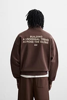 TEXT QUARTER ZIP SWEATSHIRT